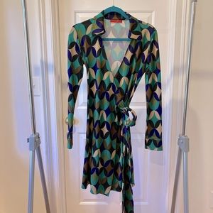 Retro print, multi-color wrap dress.  Polyester.  Size 6